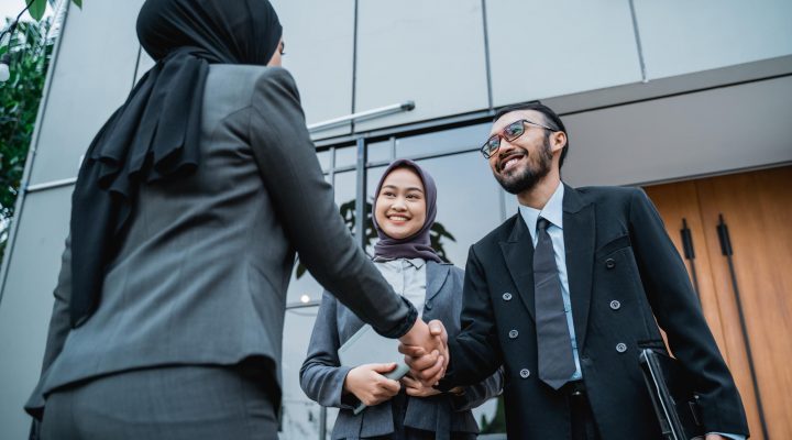 muslim-business-partner-shaking-hand-office-front-during-first-meeting-business-formal-greeti